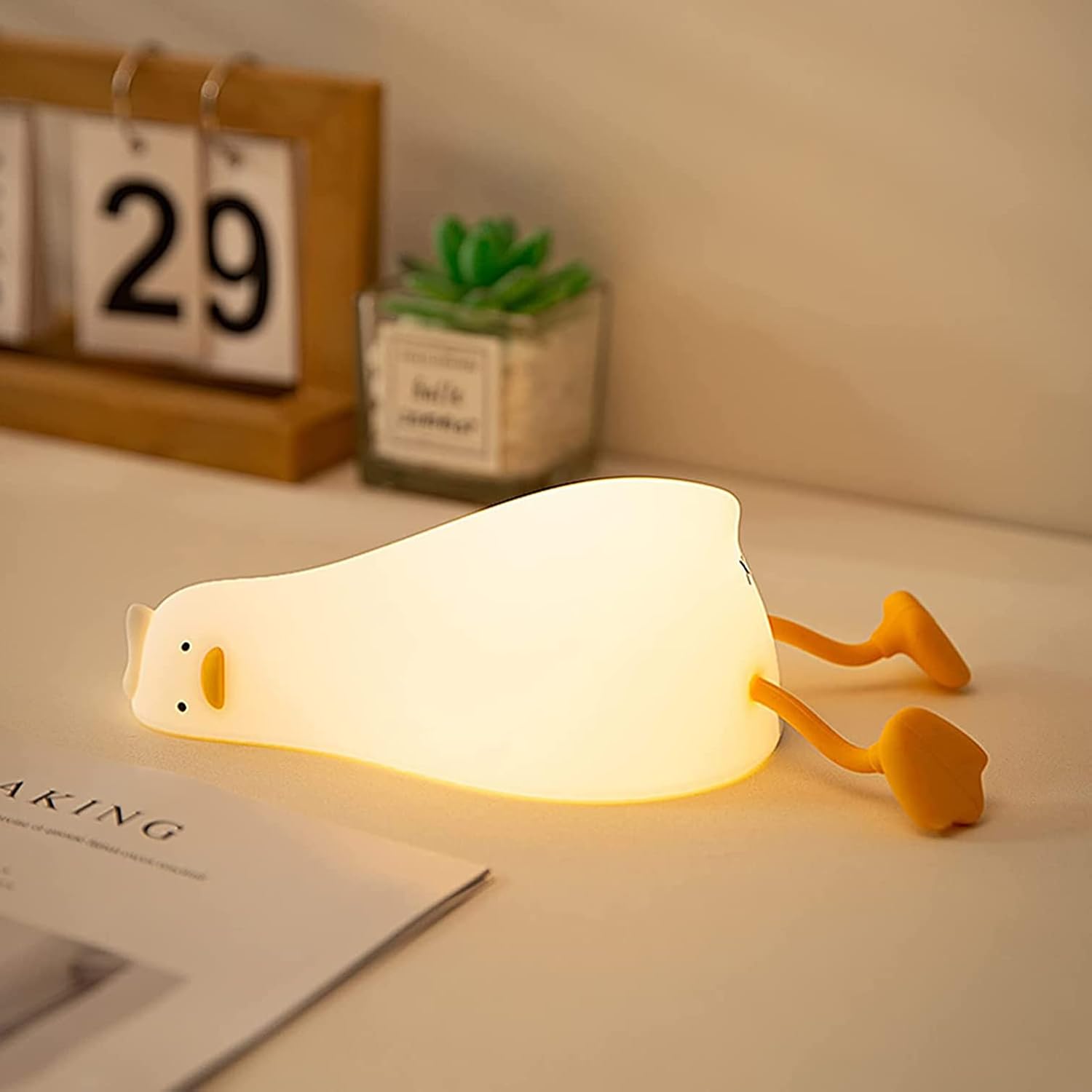 51Qz0pWd9L._AC_SL1500_.jpg Duck Silicone Night Light with Phone Stand - Image 1