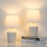 Two small table lamps with rivet textured base.