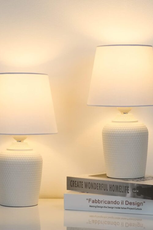 Two small table lamps with rivet textured base.