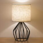 Minimalist table lamp with hollow base.